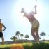 Female Golfer Playing A Shot